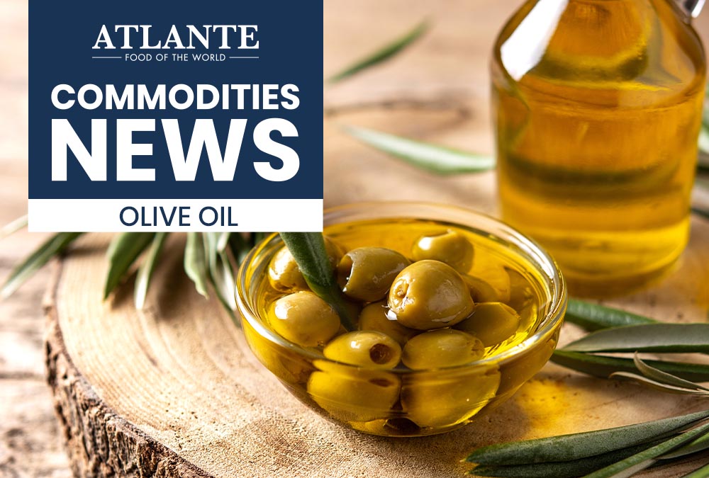 Bottles of Italian and Spanish extra virgin olive oil, key players in the global market amidst climate challenges and production growth.